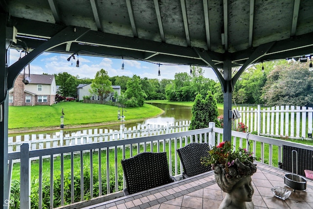 9001 Harrison Run Ct, Indianapolis, IN 46256 - view of patio / terrace with a water view and view of scattered trees