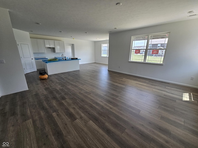 2339 Pine Valley Dr, Plainfield, IN 46168 - unfurnished living room featuring dark wood-style floors and a sink