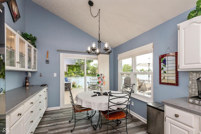 3403 Island Way, Indianapolis, IN 46214 - dining space featuring lofted ceiling, dark wood-type flooring, a chandelier, and baseboards