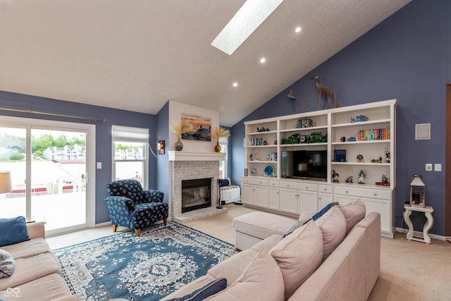 3403 Island Way, Indianapolis, IN 46214 - living area featuring light carpet, vaulted ceiling, a skylight, a brick fireplace, and recessed lighting