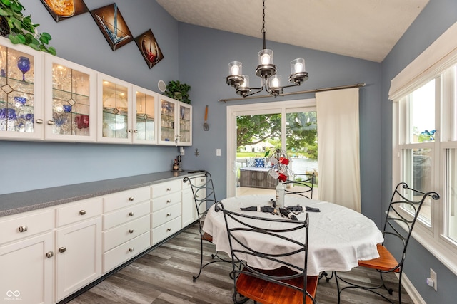 3403 Island Way, Indianapolis, IN 46214 - dining room with vaulted ceiling, a chandelier, and dark wood-type flooring