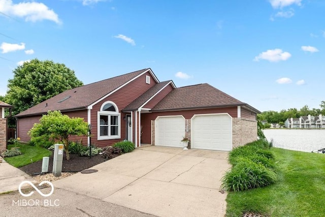 3403 Island Way, Indianapolis, IN 46214 - ranch-style home featuring a garage, driveway, a front yard, and roof with shingles