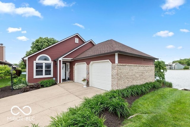 3403 Island Way, Indianapolis, IN 46214 - single story home featuring a garage, brick siding, concrete driveway, and roof with shingles