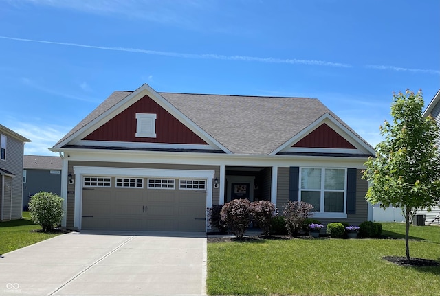 1349 Sunset Blvd, Avon, IN 46123 - view of front of home featuring board and batten siding, concrete driveway, a shingled roof, a front yard, and a garage