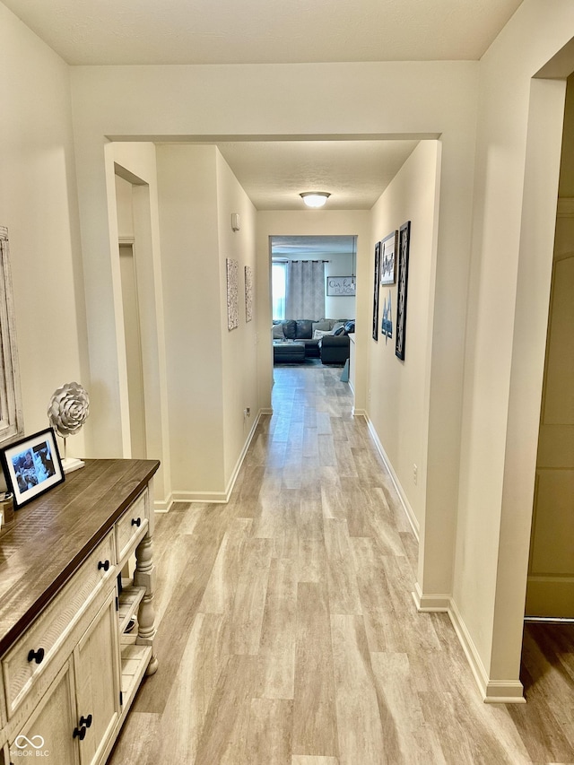 1349 Sunset Blvd, Avon, IN 46123 - hallway featuring light wood-style floors and baseboards