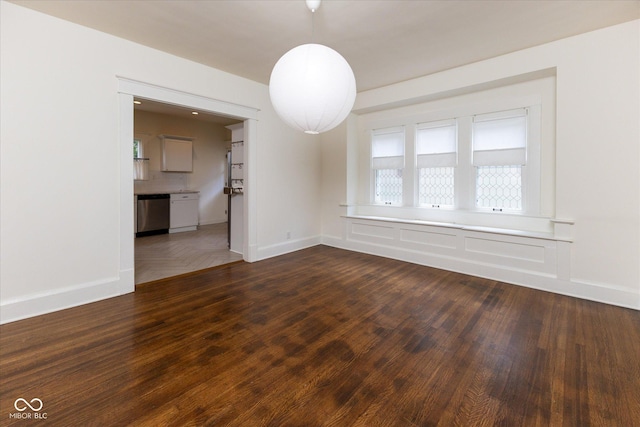 1311 N Oakland Ave, Indianapolis, IN 46201 - empty room with dark wood-style flooring and baseboards