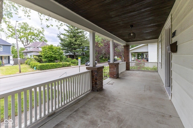 1311 N Oakland Ave, Indianapolis, IN 46201 - covered porch with a residential view and a yard