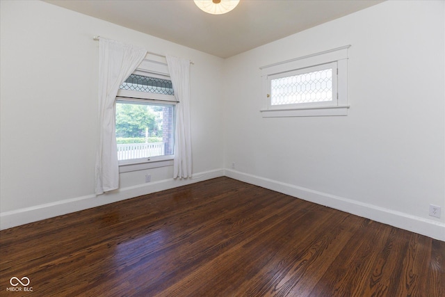 1311 N Oakland Ave, Indianapolis, IN 46201 - unfurnished room with baseboards and dark wood-style floors