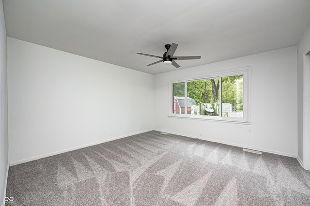 7414 Mendenhall Rd, Camby, IN 46113 - unfurnished room featuring ceiling fan, baseboards, and carpet