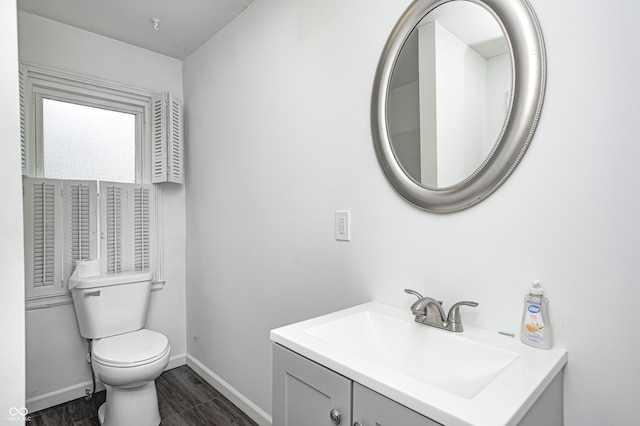 7414 Mendenhall Rd, Camby, IN 46113 - bathroom with vanity, toilet, baseboards, and wood finished floors