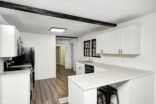 7414 Mendenhall Rd, Camby, IN 46113 - kitchen with a sink, black dishwasher, range with electric cooktop, wood finished floors, and beamed ceiling