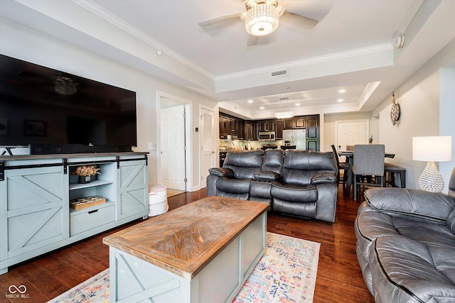 20971 Shoreline Ct Unit 201, Noblesville, IN 46062 - living room featuring a raised ceiling, a ceiling fan, dark wood-type flooring, ornamental molding, and recessed lighting