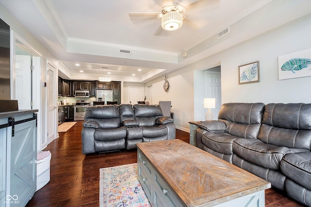 20971 Shoreline Ct Unit 201, Noblesville, IN 46062 - living area with a tray ceiling, ceiling fan, dark wood-style floors, ornamental molding, and recessed lighting