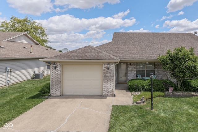 2025 Flamingo Way, Franklin, IN 46131 - view of front facade with central air condition unit, concrete driveway, an attached garage, brick siding, and a front yard