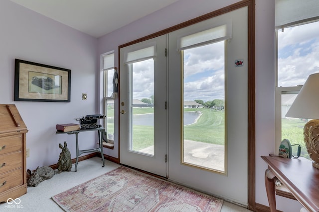 2025 Flamingo Way, Franklin, IN 46131 - doorway to outside with light colored carpet and a water view