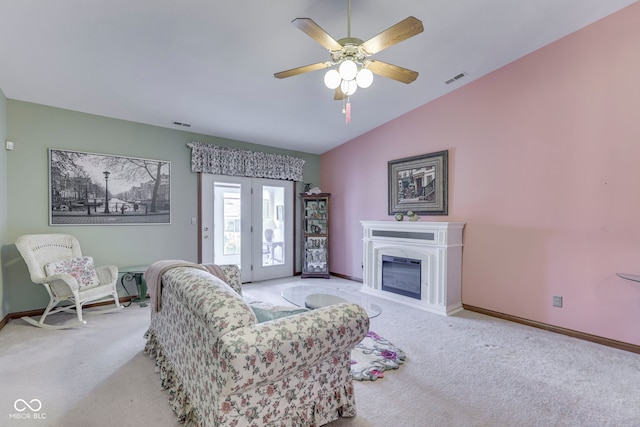 2025 Flamingo Way, Franklin, IN 46131 - carpeted living room with lofted ceiling, baseboards, ceiling fan, and a glass covered fireplace
