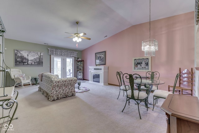 2025 Flamingo Way, Franklin, IN 46131 - living room with lofted ceiling, ceiling fan, carpet, a chandelier, and a glass covered fireplace