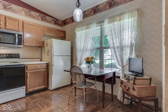 2025 Flamingo Way, Franklin, IN 46131 - kitchen featuring stainless steel microwave, range with electric stovetop, freestanding refrigerator, wallpapered walls, and light countertops