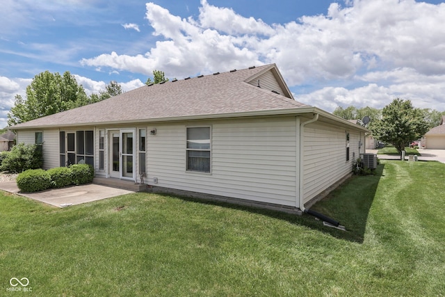 2025 Flamingo Way, Franklin, IN 46131 - back of house featuring cooling unit, a shingled roof, a lawn, and a patio area