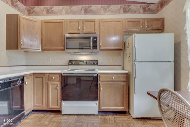 2025 Flamingo Way, Franklin, IN 46131 - kitchen featuring white appliances, light countertops, wallpapered walls, and light brown cabinets