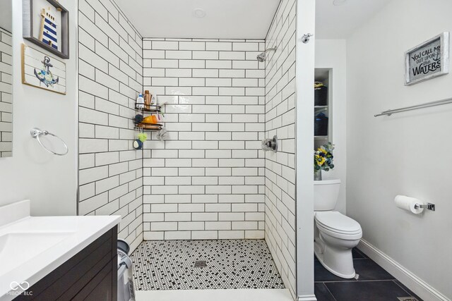 117 N Market St, Thorntown, IN 46071 - bathroom with toilet, vanity, a shower stall, and tile patterned floors