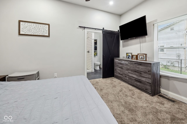 117 N Market St, Thorntown, IN 46071 - carpeted bedroom with a barn door, baseboards, and ensuite bathroom