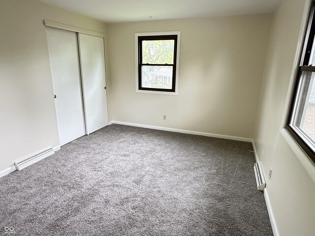 5130 Navajo Ct, Columbus, IN 47203 - unfurnished bedroom with carpet flooring, multiple windows, and a closet
