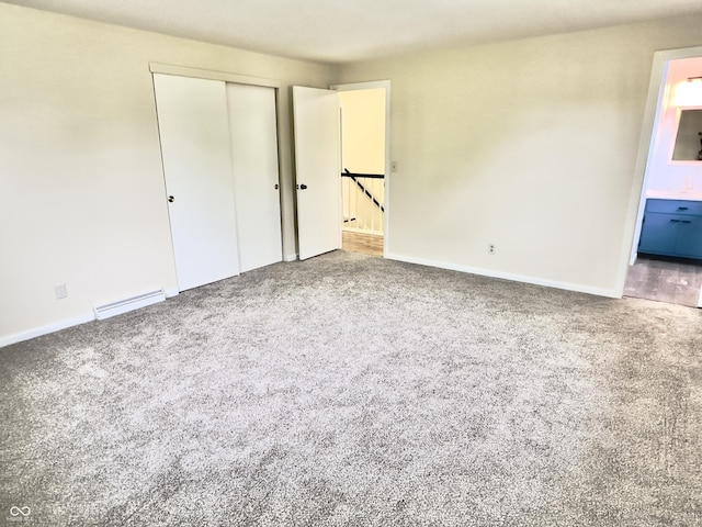 5130 Navajo Ct, Columbus, IN 47203 - unfurnished bedroom with carpet, baseboards, a closet, and ensuite bathroom