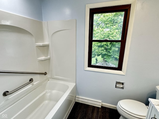 5130 Navajo Ct, Columbus, IN 47203 - full bath with wood finished floors, baseboards, vanity, toilet, and shower / bath combination