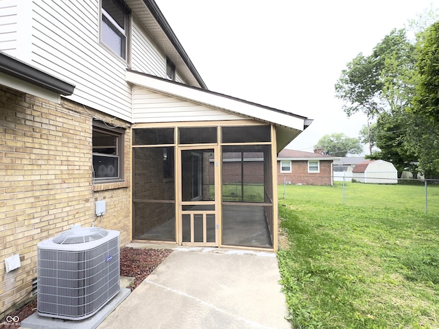 5130 Navajo Ct, Columbus, IN 47203 - view of patio with a sunroom and central AC unit