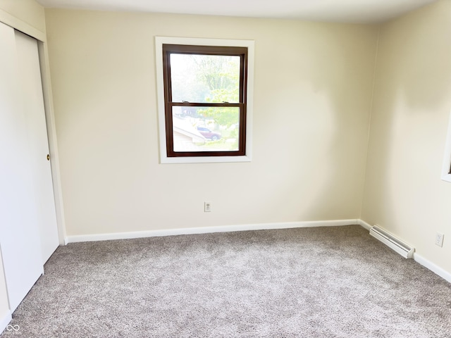 5130 Navajo Ct, Columbus, IN 47203 - unfurnished room with carpet floors, a baseboard heating unit, and baseboards