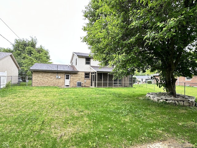 5130 Navajo Ct, Columbus, IN 47203 - view of yard featuring a sunroom and central AC unit