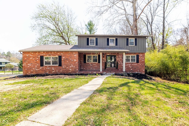 1920 E Wexley Rd, Bloomington, IN 47401 - traditional home with brick siding, a porch, a front lawn, and board and batten siding