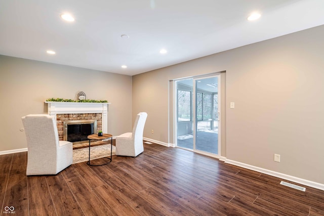 1920 E Wexley Rd, Bloomington, IN 47401 - living area with dark wood finished floors, recessed lighting, and a glass covered fireplace