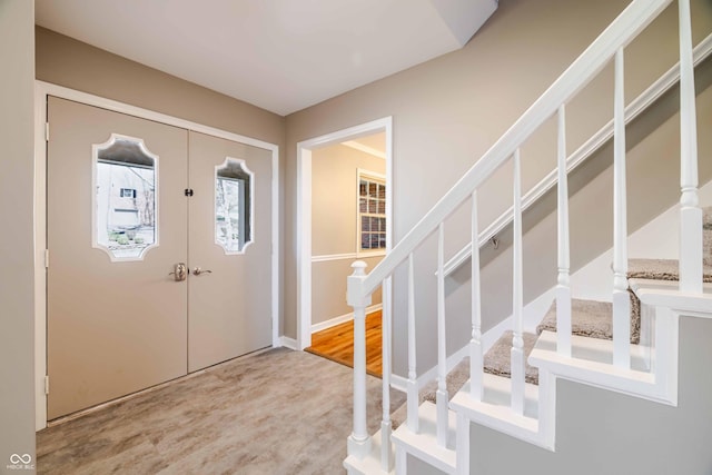 1920 E Wexley Rd, Bloomington, IN 47401 - entryway with stairs, wood finished floors, and french doors