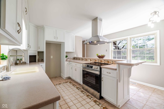 1920 E Wexley Rd, Bloomington, IN 47401 - kitchen featuring island range hood, electric range, light countertops, and light tile patterned floors