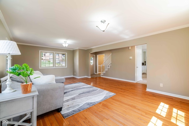 1920 E Wexley Rd, Bloomington, IN 47401 - living area with ornamental molding, stairway, and wood finished floors