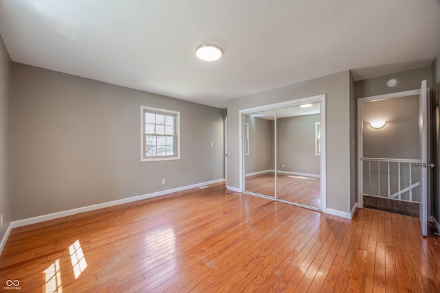 1920 E Wexley Rd, Bloomington, IN 47401 - unfurnished bedroom with light wood-style flooring and a closet