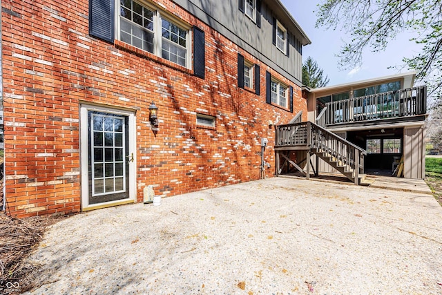 1920 E Wexley Rd, Bloomington, IN 47401 - rear view of house featuring stairway, brick siding, and a deck