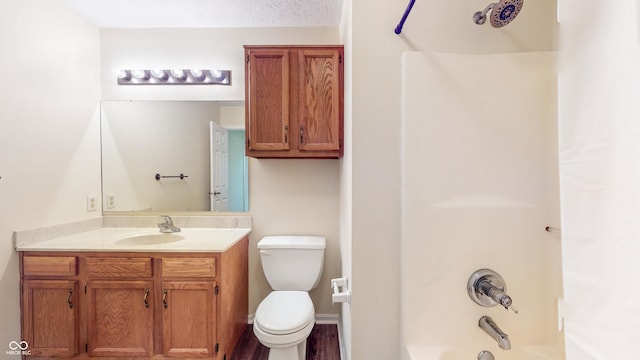 3916 Jekyll Ct, Indianapolis, IN 46237 - full bathroom featuring vanity, toilet, shower / washtub combination, and wood finished floors
