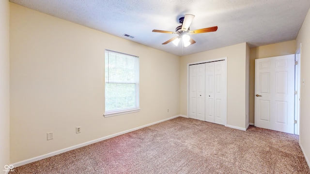 3916 Jekyll Ct, Indianapolis, IN 46237 - unfurnished bedroom with carpet flooring, a closet, baseboards, and a ceiling fan