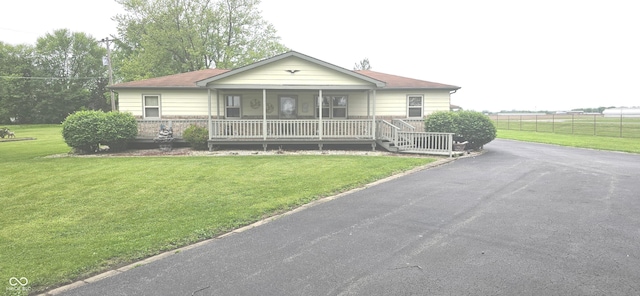3107 N 100 W, Shelbyville, IN 46176 - view of front facade featuring a porch and asphalt driveway