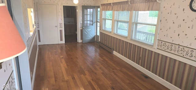 3107 N 100 W, Shelbyville, IN 46176 - entrance foyer featuring wallpapered walls, a baseboard heating unit, and wood finished floors
