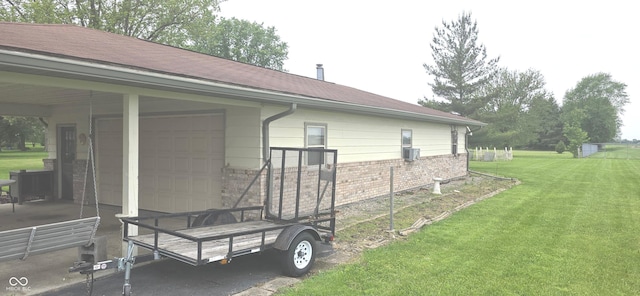3107 N 100 W, Shelbyville, IN 46176 - view of side of property featuring a yard, a garage, and brick siding
