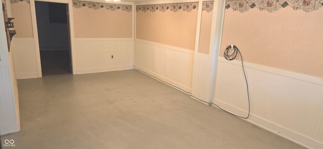 3107 N 100 W, Shelbyville, IN 46176 - spare room with a wainscoted wall, finished concrete floors, and a decorative wall