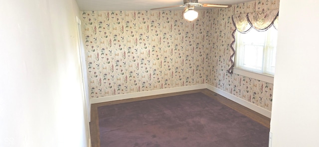 3107 N 100 W, Shelbyville, IN 46176 - spare room featuring wallpapered walls, dark wood-type flooring, baseboards, and ceiling fan