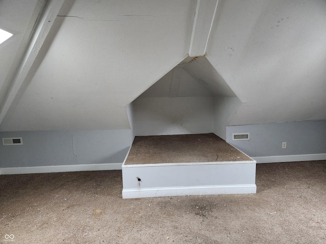 2707-2709 N College Ave, Indianapolis, IN 46205 - additional living space with vaulted ceiling, baseboards, and carpet floors