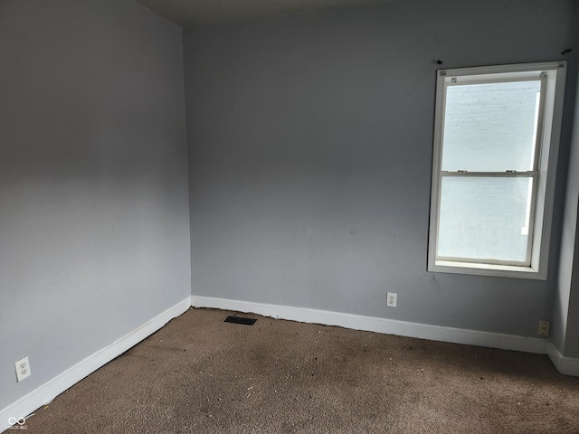2707-2709 N College Ave, Indianapolis, IN 46205 - carpeted spare room featuring baseboards
