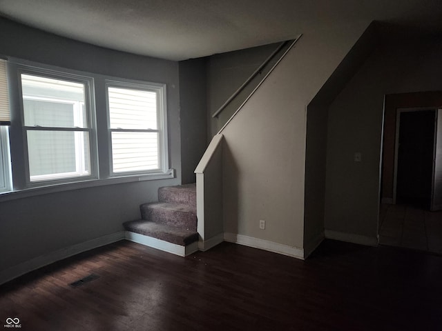 2707-2709 N College Ave, Indianapolis, IN 46205 - stairway featuring wood finished floors and baseboards
