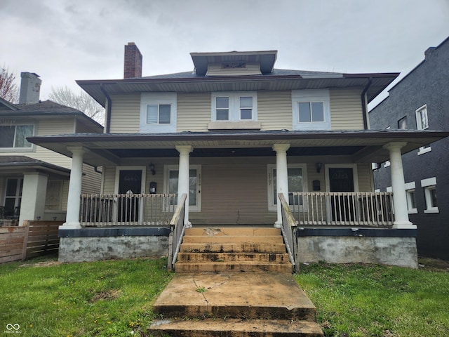 2707-2709 N College Ave, Indianapolis, IN 46205 - traditional style home with covered porch and a chimney